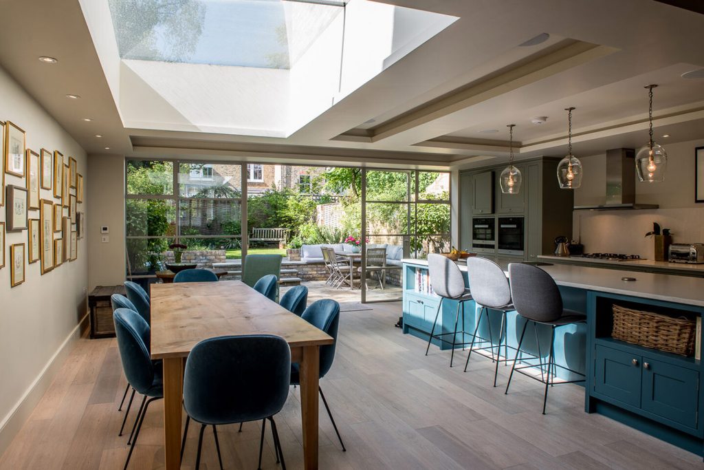 Dark Teal Island and Chairs Contrast and Make This Kitchen Pop with Color